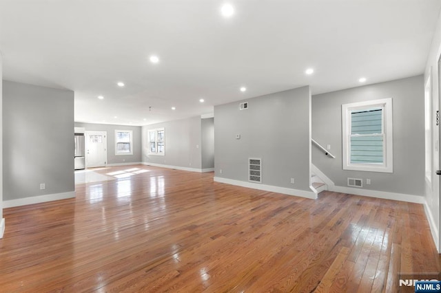 unfurnished living room with light wood-type flooring