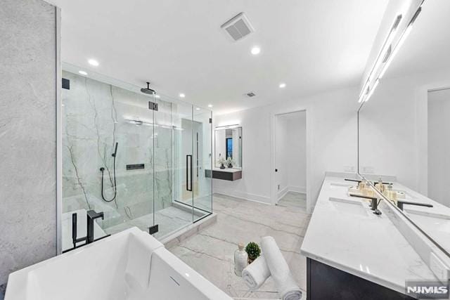 bathroom with shower with separate bathtub and vanity