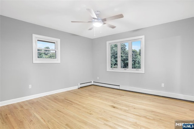 unfurnished room featuring ceiling fan, a baseboard radiator, and light hardwood / wood-style floors