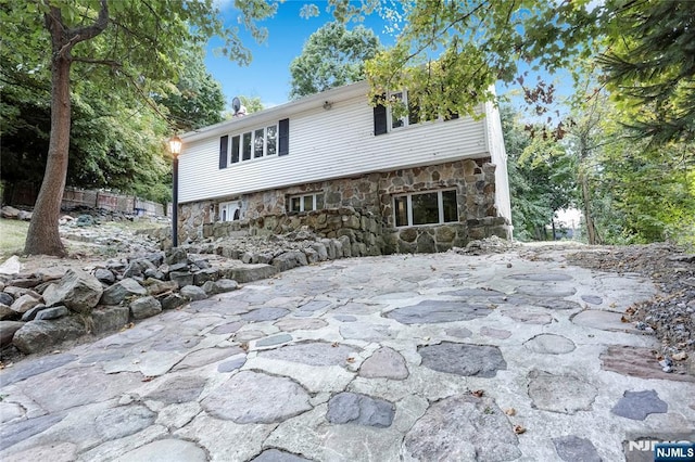 view of front of property featuring a patio