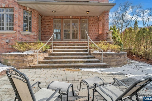 property entrance featuring a patio