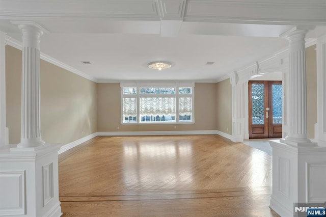 interior space with french doors, crown molding, decorative columns, and light wood-type flooring