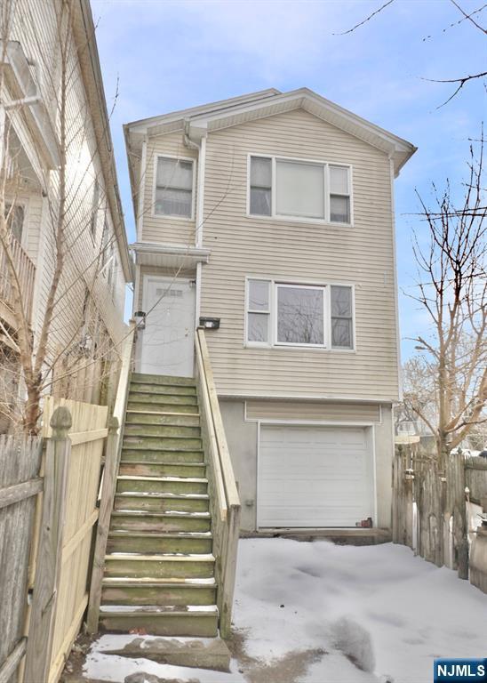 front of property featuring a garage