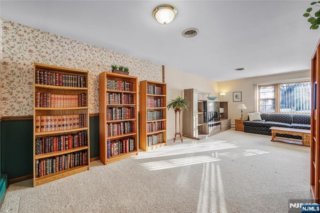 unfurnished room with light colored carpet