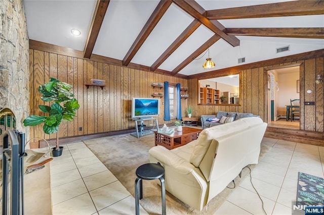 living room with light tile patterned floors, vaulted ceiling with beams, and wood walls