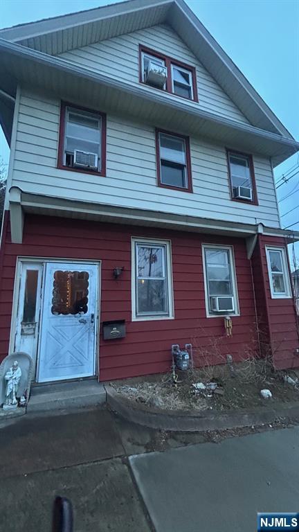 view of front of house with cooling unit