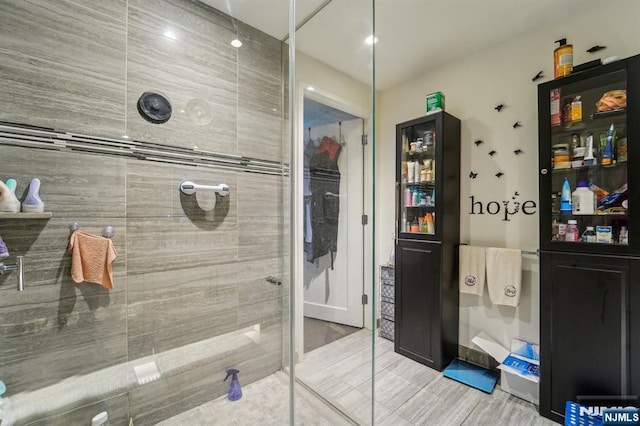 bathroom with a tile shower