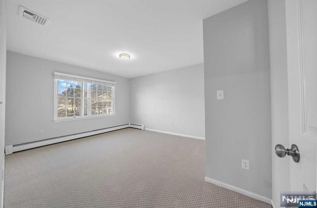 unfurnished room with a baseboard radiator and carpet