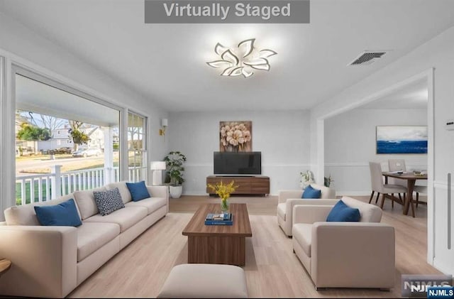 living room with light wood-type flooring