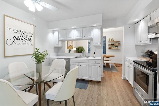 kitchen with white cabinetry, sink, and stainless steel appliances