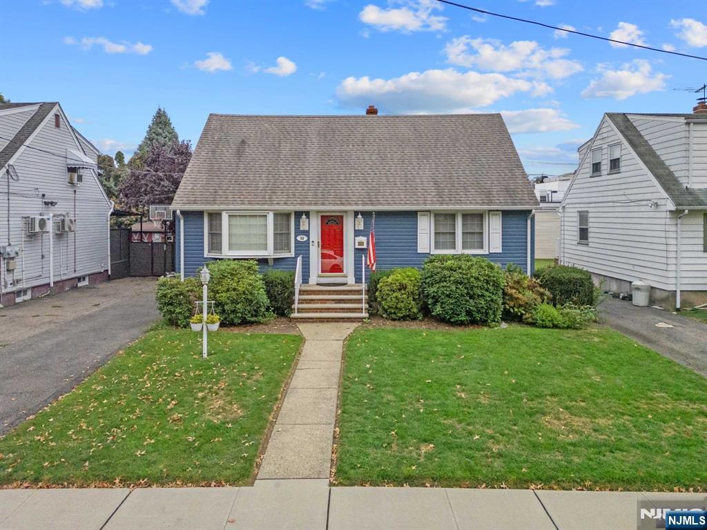 bungalow with a front yard