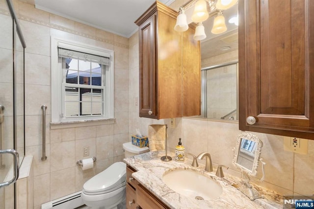 bathroom with a shower with door, baseboard heating, tile walls, vanity, and toilet