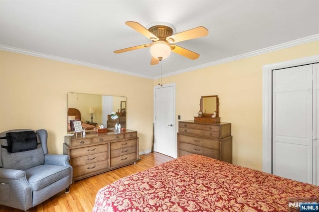 bedroom featuring ceiling fan, ornamental molding, and light hardwood / wood-style flooring