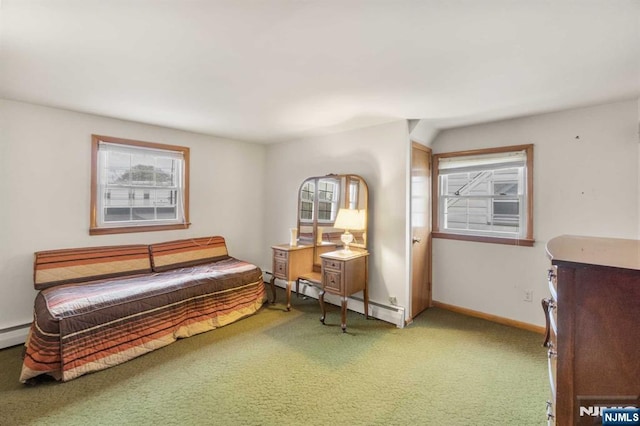 carpeted bedroom featuring baseboard heating