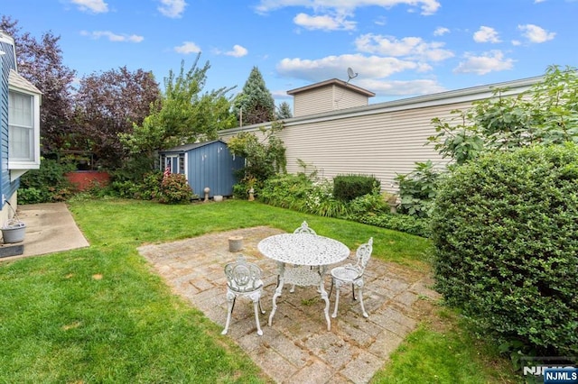 view of yard with a shed and a patio