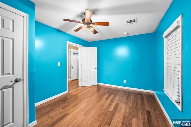 unfurnished bedroom featuring ceiling fan and hardwood / wood-style floors