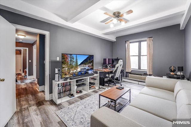 living room featuring ceiling fan, a baseboard radiator, wood finished floors, baseboards, and beamed ceiling