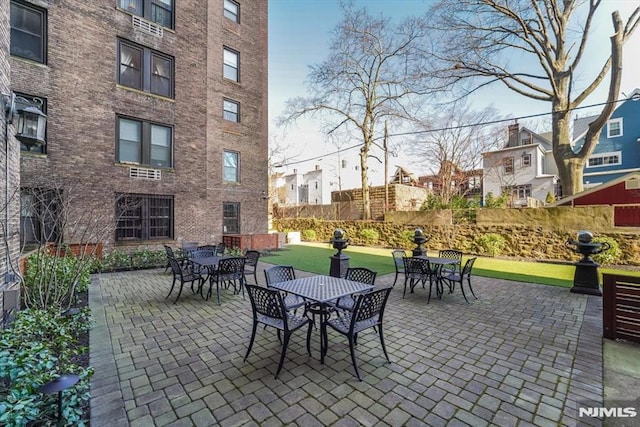 view of patio / terrace featuring outdoor dining area and fence