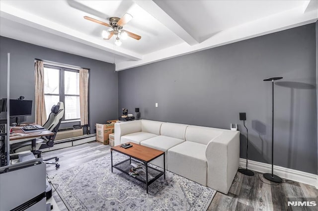 office with ceiling fan, beamed ceiling, wood finished floors, and baseboards