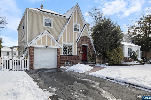 tudor home with a garage