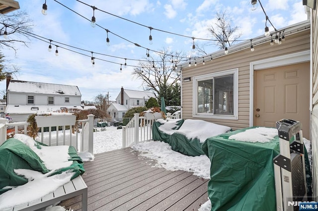 view of snow covered deck