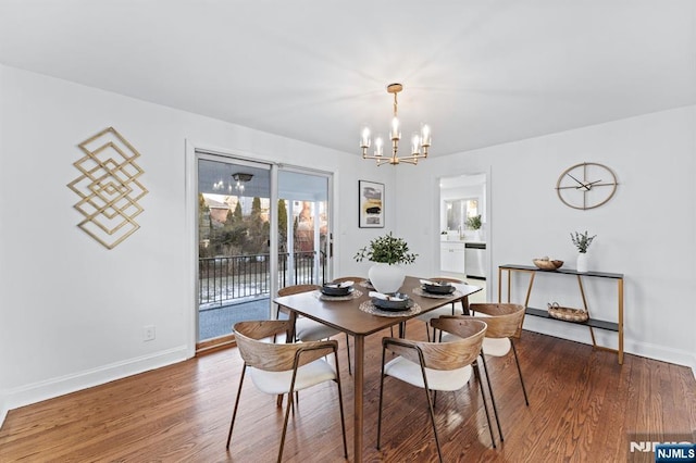 dining area featuring plenty of natural light, a chandelier, and dark hardwood / wood-style flooring