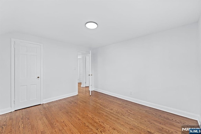 empty room featuring wood-type flooring