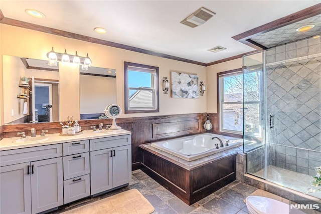 bathroom featuring crown molding, vanity, plus walk in shower, and a wealth of natural light