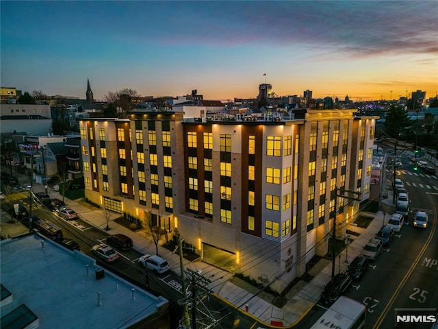 view of outdoor building at dusk