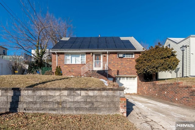 view of front of home featuring a garage and solar panels