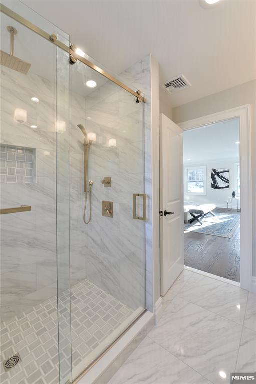 bathroom featuring walk in shower