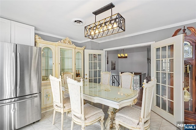 tiled dining room with crown molding, french doors, and a notable chandelier