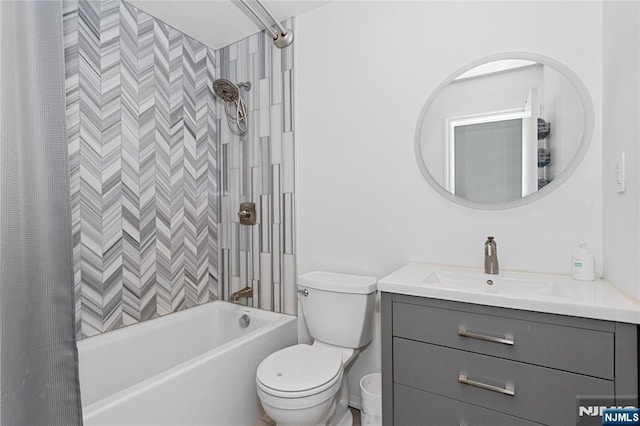 full bathroom with vanity, shower / tub combo with curtain, and toilet