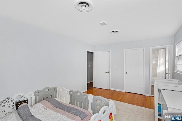 bedroom featuring hardwood / wood-style floors