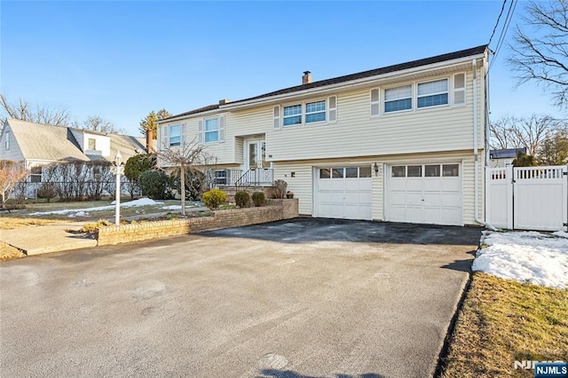 raised ranch featuring a garage