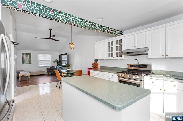 kitchen with appliances with stainless steel finishes, white cabinetry, hanging light fixtures, a center island, and ceiling fan