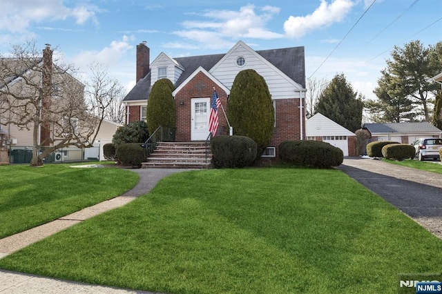 view of front of house featuring a garage and a front yard