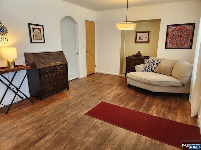 living area with hardwood / wood-style flooring