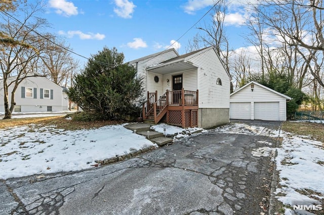 view of front of property with an outbuilding and a garage