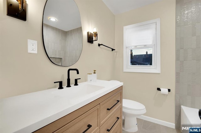 bathroom with vanity, toilet, and tile patterned flooring