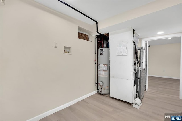 utility room with water heater