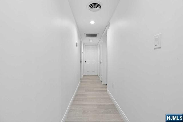 hallway featuring light hardwood / wood-style flooring