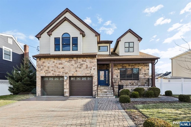 view of front of home with a garage and covered porch