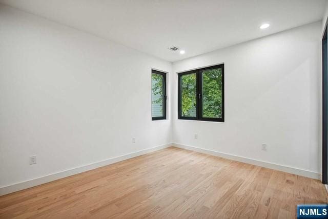 unfurnished room featuring light wood-type flooring