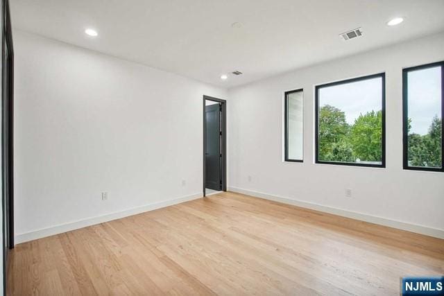 empty room with light hardwood / wood-style floors