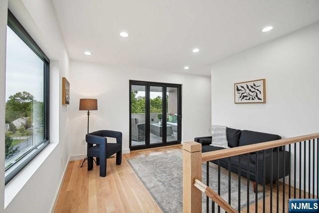 living room featuring french doors and hardwood / wood-style floors