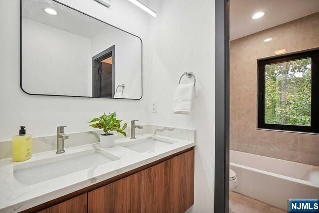 bathroom featuring vanity and toilet