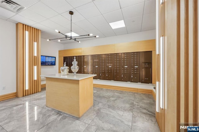 view of community featuring mail boxes and an inviting chandelier