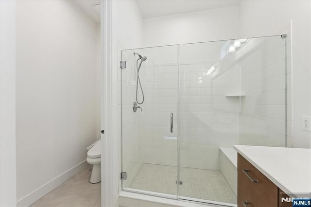 bathroom with vanity, an enclosed shower, tile patterned floors, and toilet