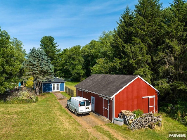 view of outbuilding with a lawn